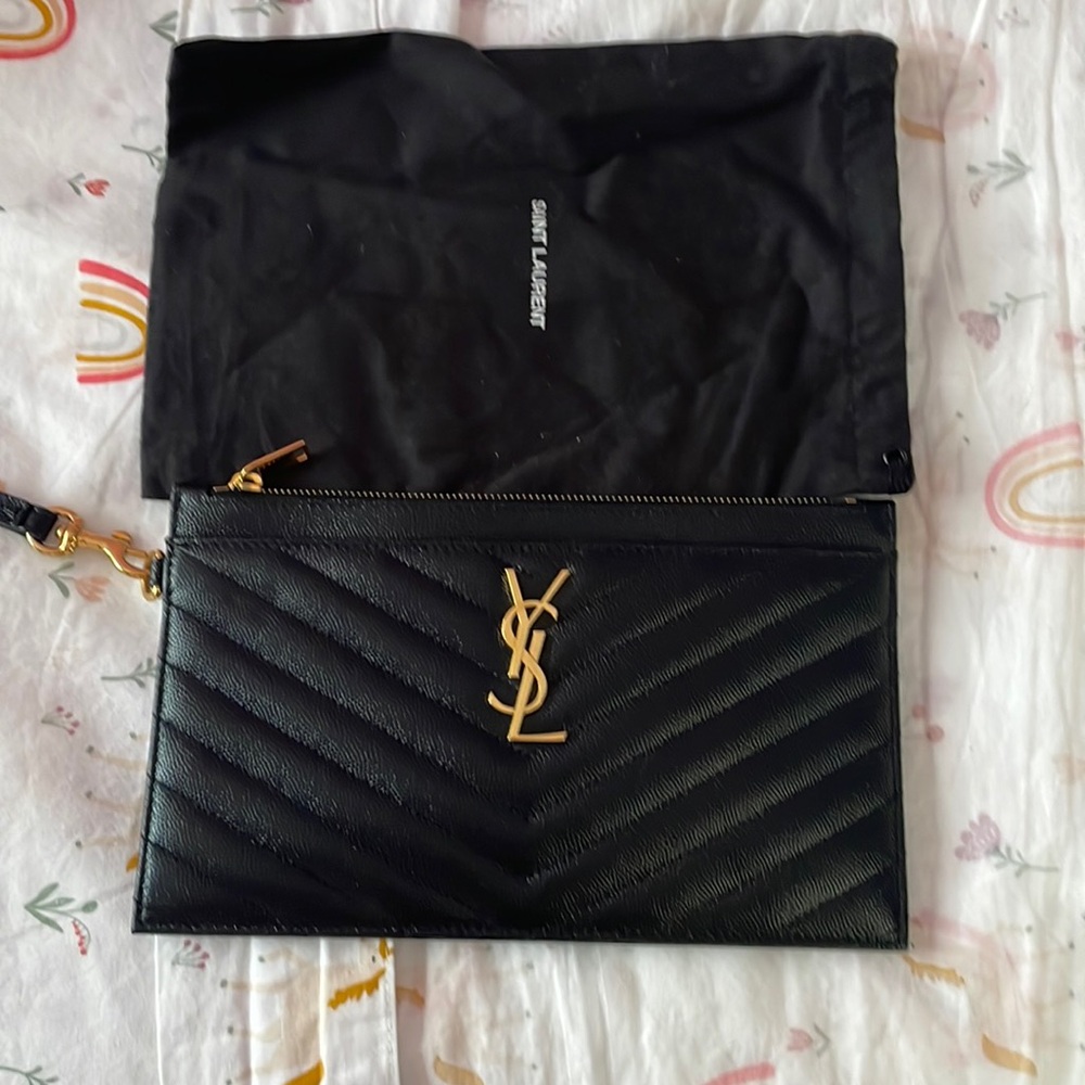 Saint Laurent
Monogram Quilted Leather Wallet Clutch in black.